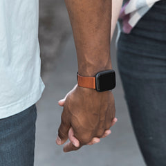 Deployant Reserve leather band in burnt orange man and woman holding hands